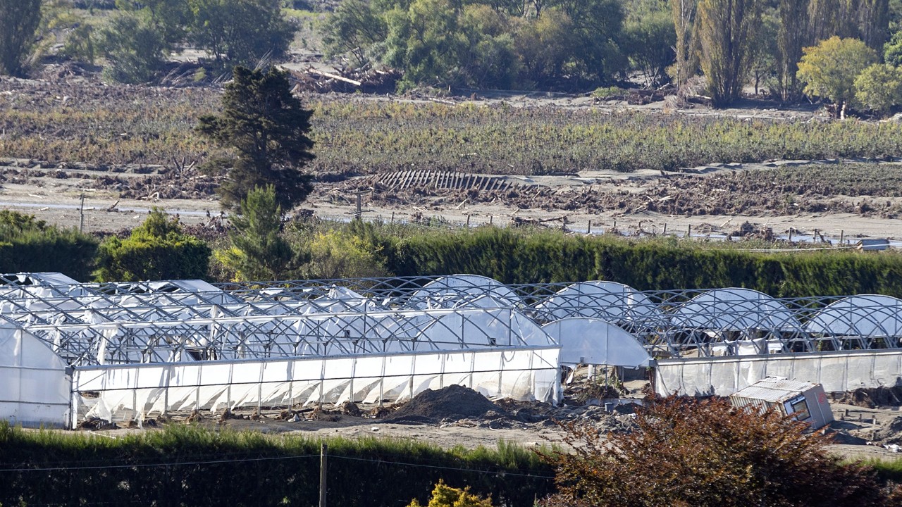 Ruined greenhouses and the twisted rail line in the Esk Valley, just north of Napier, following Gabrielle.